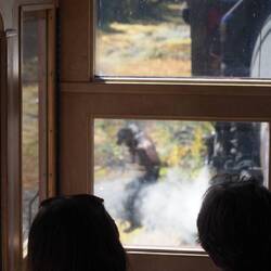 The fireman jumping out of the engine