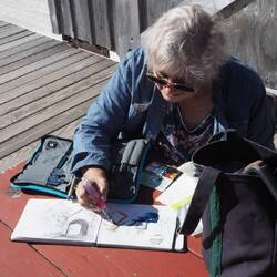 Jill painting a picture of the engine