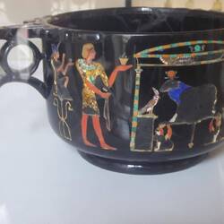 Obsidian bowl with inlaid precious stone