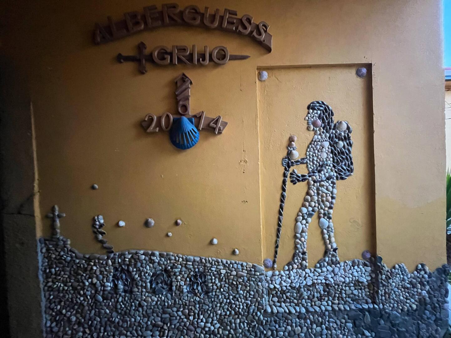 A sign at our hostel made of stones and shells.