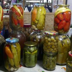 Lots of pickles, including jars of whole garlic cloves