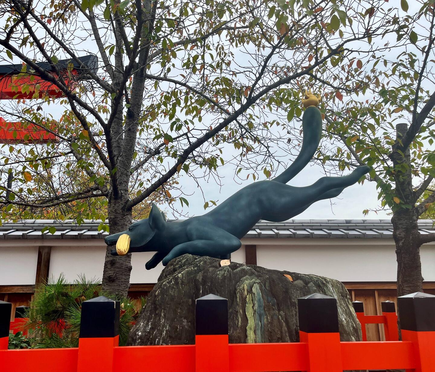 A leaping fox ushers us in to the shrine