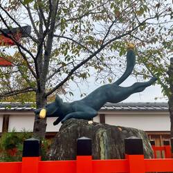 A leaping fox ushers us in to the shrine
