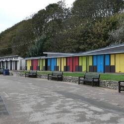 Beach huts, or chalets, reminiscent of the golden age of coastal holidays