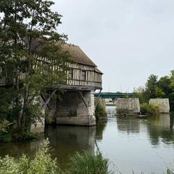 Old bridge with house. This is the river Seine still, it goes all the way to Paris