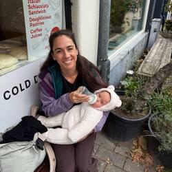 Chelsea feeding Billie outside the sandwich spot