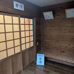 Baths are gender segregated, there's usually just a red curtain and a blue curtain. Shoes off again