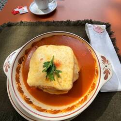 Traditional Portuguese dish called Francesinha. Loaded with calories and not really that good.