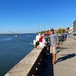 Fishing from the edge of the street