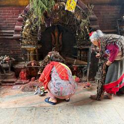 Ladies giving offerings at Hindu site