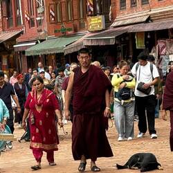 The crowds circle the stupa clockwise for hours with chants and prayers.