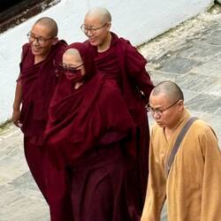 Buddhist monks circling the stupa