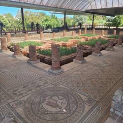 Large home with mosaic floors and a central garden
