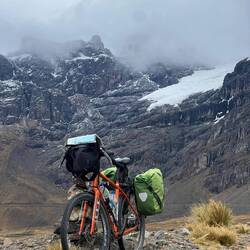 Alice's bike Constance at 4850m with glacier behind
