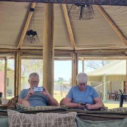 Two old folks chilling in the lounge. No AC and it's hot and dry.