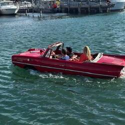 The Amphicar chucks a lap around the marina, past "45 North"