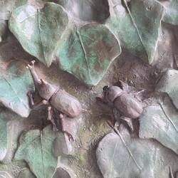 The ivy door and the insects were created by Etsuro Sotoo a Japanese sculptor