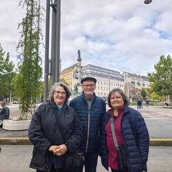 Posing at the tram stop with our apartment in the background.