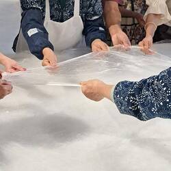 This is how the layers of silk comforters are made. Very fine, very manual.
