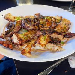 Grilled octopus with a sweet sauce and olive oil