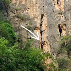 Another coffin in an elevated cave.