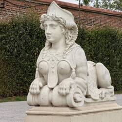 Baroque sphinx sculpture with human head, birds wings, body of a lion and perky boobs!