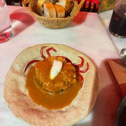 Salty spider crab with lobster bisque sauce and crumpet