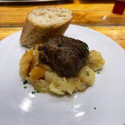 Pork cheek with very salty potatoes