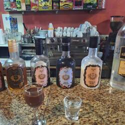5 flavored liqueurs and Bagaço moonshine