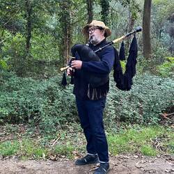 Man playing bagpipes in the middle of nowhere. Love it!