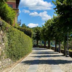 Our walk starts out flat on the road along the shoreline of Lake Orta — Orta San Giulio, Italy.