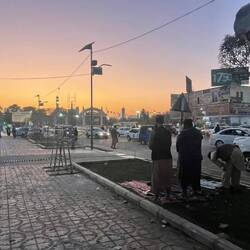 Officials for Maghreb prayer - never far from their rifle.