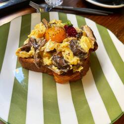 Chanterelle porcini shiitake mushroom with hazelnut butter on brioche topped with egg