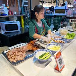 Zubereitung der Spezialität Pekingente