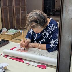 Some people collect calligraphy on a scroll