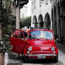 A gleaming red Fiat Cinquecento ... an older model, I believe — Orta San Giulio, Italy.