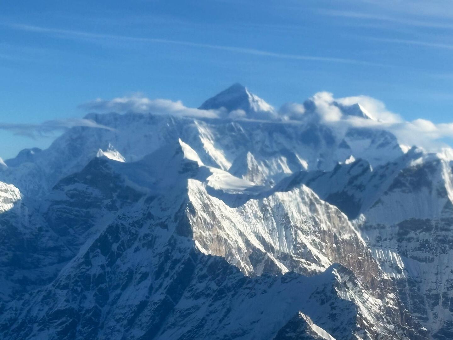 The high peak of Everest just above the clouds