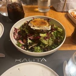 Green salad with goat cheese stuffed portobello mushroom and figs.