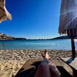 Front row sunbed at Ornos beach.