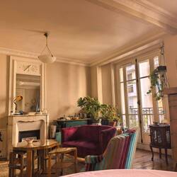 The apartment with its beautiful Designers Guild chairs.