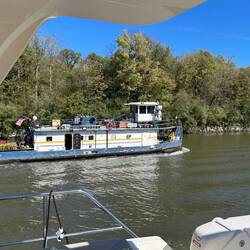 A lone pusher tug goes looking for its next barge-load