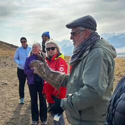 Brad, trying on the glove that is made from cow skin