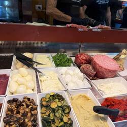 So many toppings at the sandwich spot!
