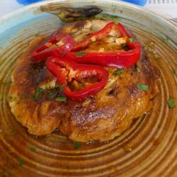 Hotel signature dish - pork & veg casserole covered with omelette