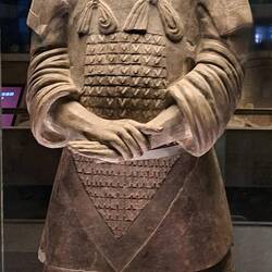 Ornate armor, headdress & hands placement suggest this was one of the highest ranking warriors.