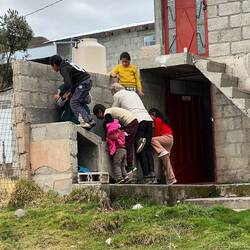 Village kids "helping" Alain with the water filter