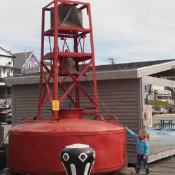 Little girl ringing the bouy bell