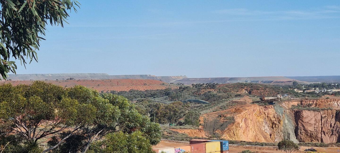 In the background you can see the enormity of the mine and pit.