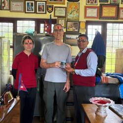 Another welcoming ceremony, tika, mala (lei) and a school coffee mug.