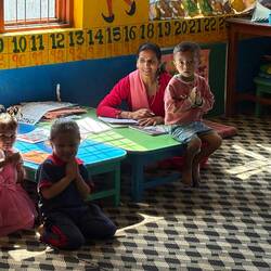 Preschool teacher with her students